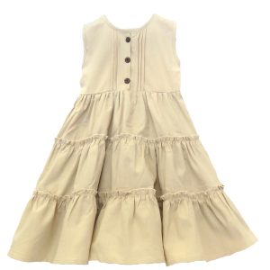 kids on trend cream coloured linen dress with a tiered skirt front view