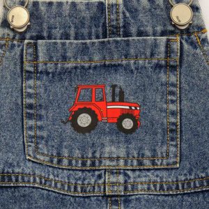 kids on trend dark blue denim overalls close up of red tractor printed on pocket