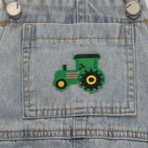 kids on trend faded denim overalls with close up of tractor on front pocket