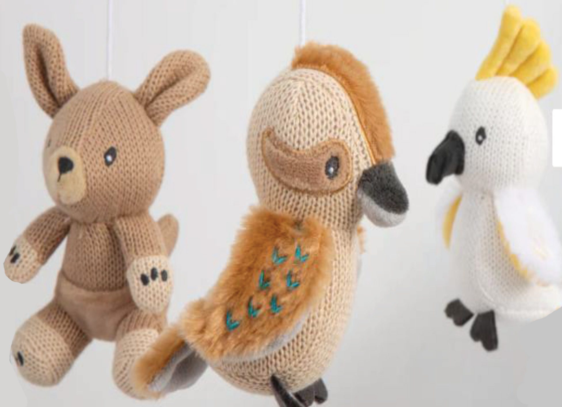 musical mobile with four aussie animals - close up of kangaroo, kookaburra and cockatoo