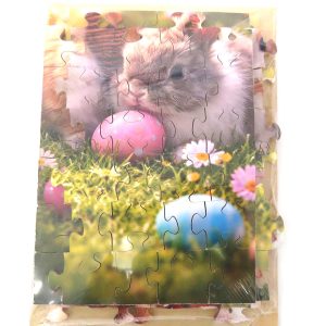 easter puzzle featuring three little rabbits and a basket full of eggs close up of pieces