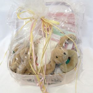 large hamper for babies wrapped in cellophane and tied with raffia ribbon