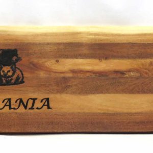 laser printed tassie devil and wombat on a long platter board made of strips of light and dark acacia wood