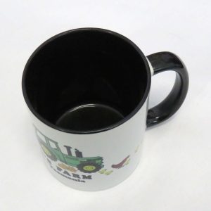 old macs coffee mug in black with cartoon style green tractor and animals