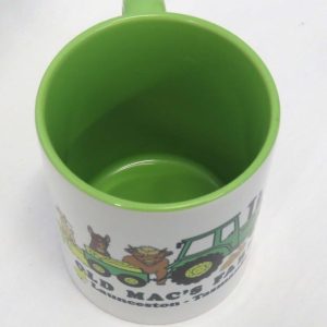 old macs coffee mug in green with cartoon style green tractor and animals