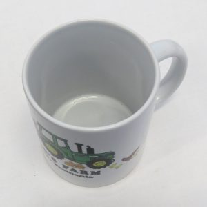 old macs coffee mug in white with cartoon style green tractor and animals