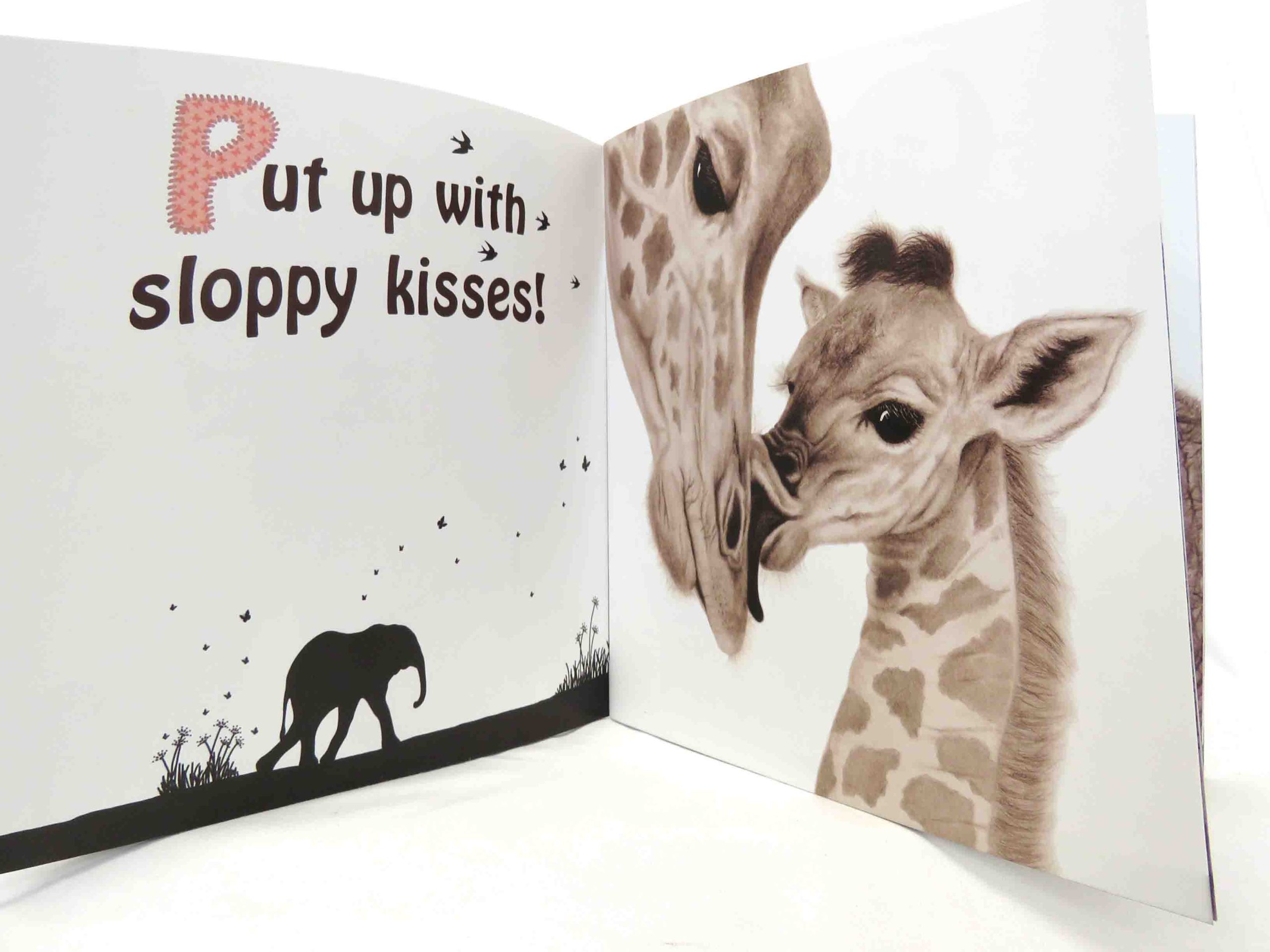 inside pages of mothers and babies and all the best dads book with baby giraffe image