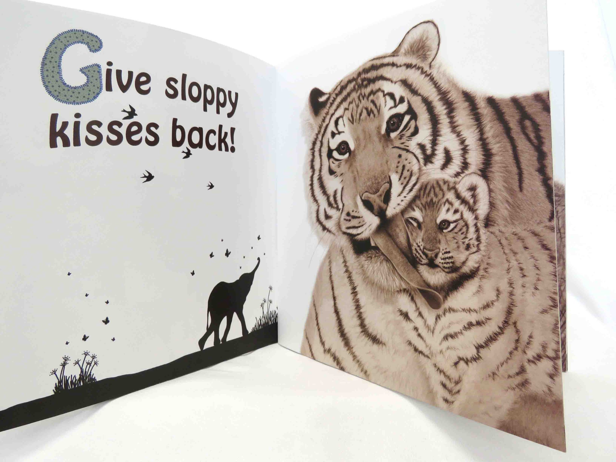 inside pages of mothers and babies and all the best dads book with tiger and baby image