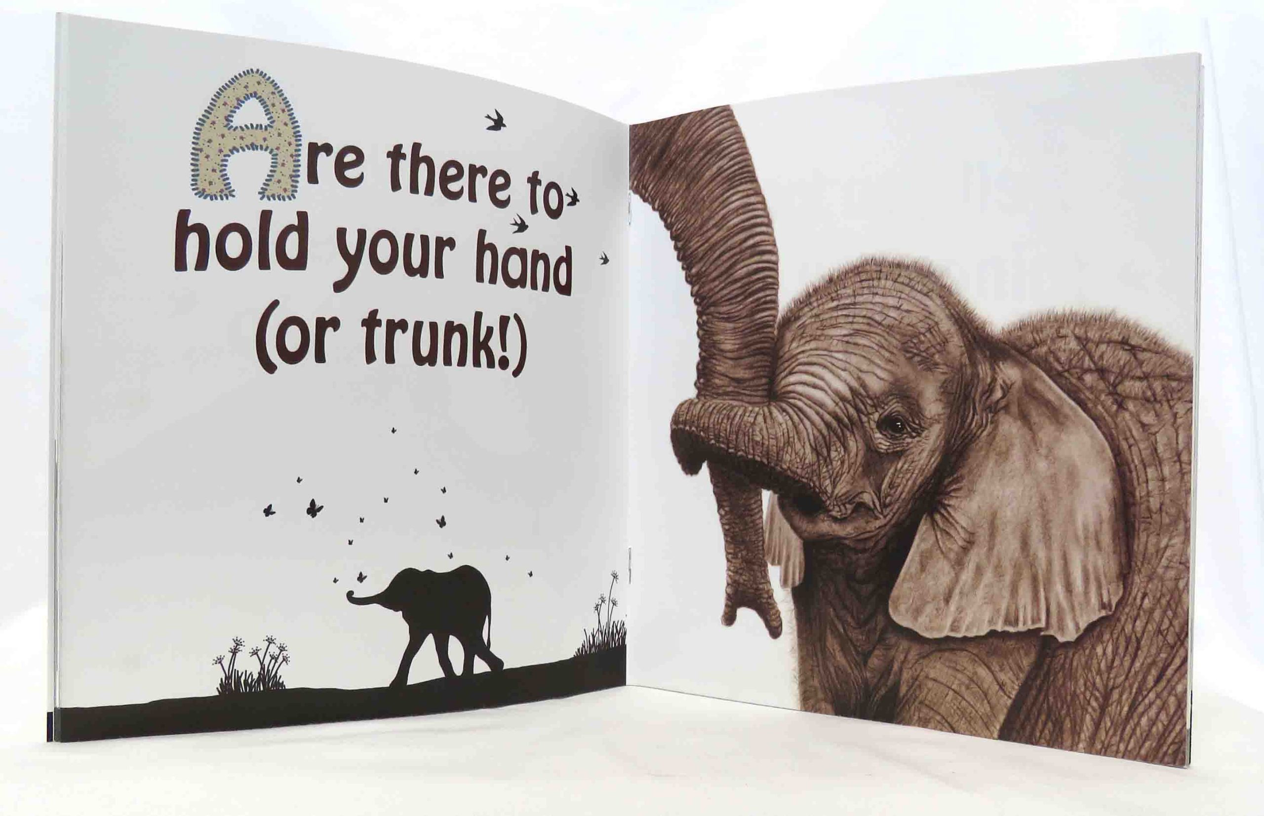inside pages of mothers and babies and all the best dads book with baby elephant image