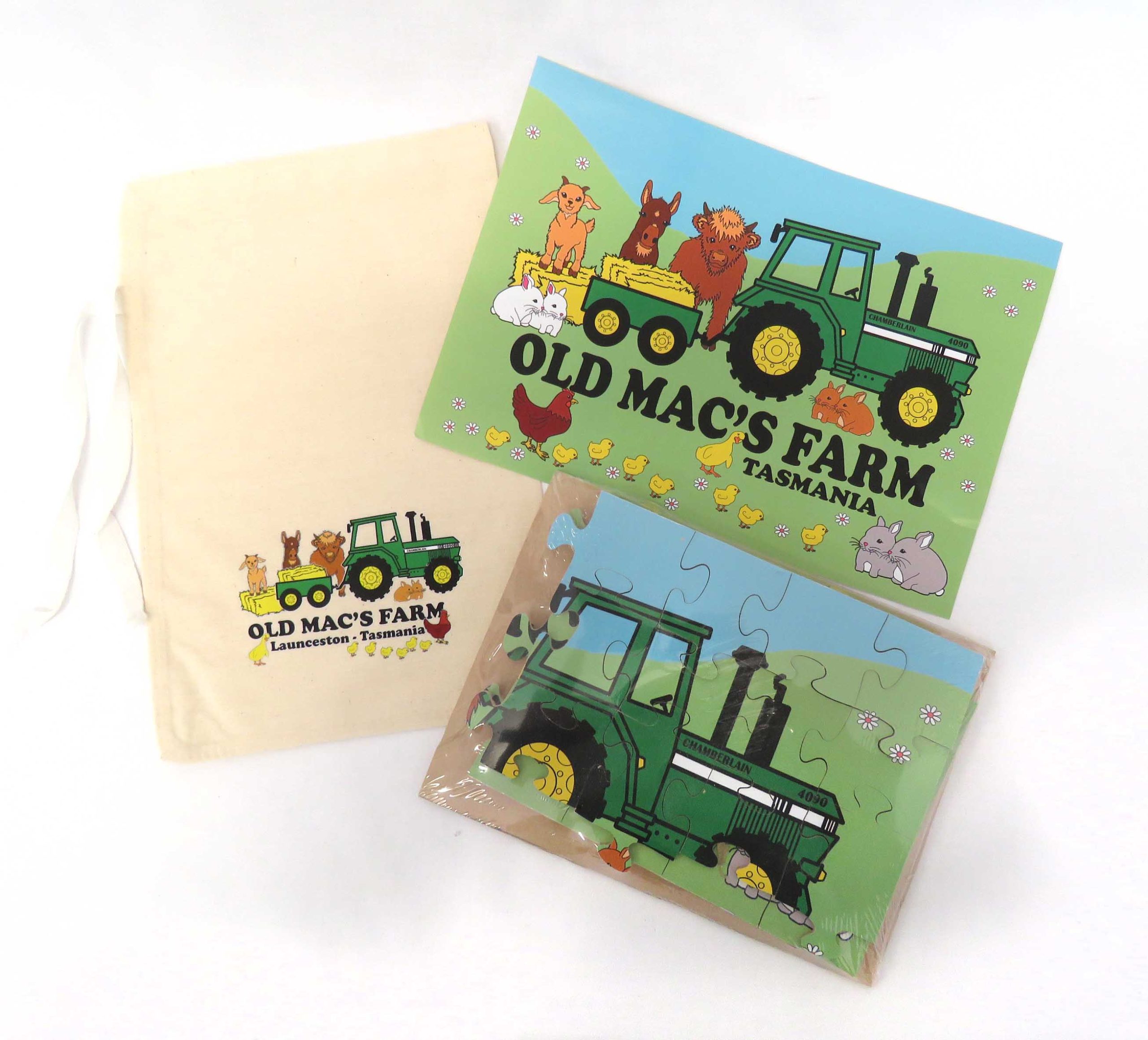 old macs puzzle featuring old macs logo of cartoon style tractor and animals comes with a calico bag with old macs logo