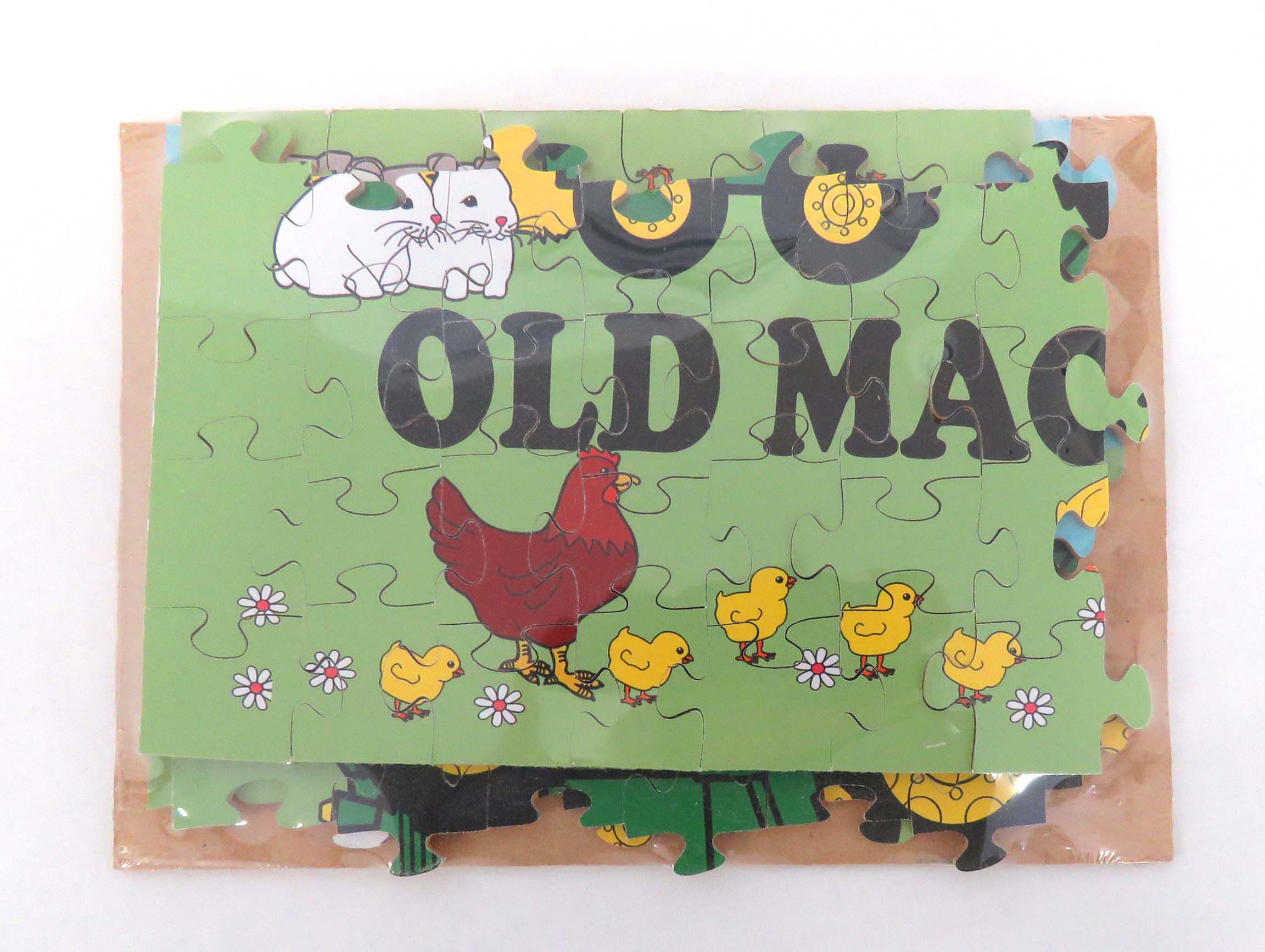 old macs puzzle featuring old macs logo of cartoon style tractor and animals close up of 117 pieces