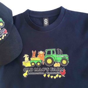 dark blue tshirt and cap with old mac's farm print on them - sarah prince design