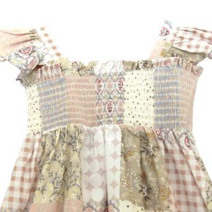 kids on trend patchwork printed dress in pink and brown showing detail of bodice and straps
