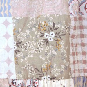 kids on trend patchwork printed dress in pink and brown detail of patches 1