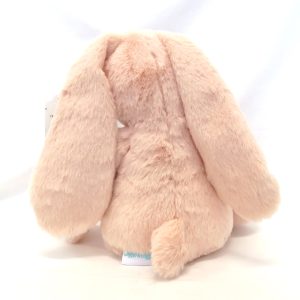 large peach pink bunny with floral ears back view