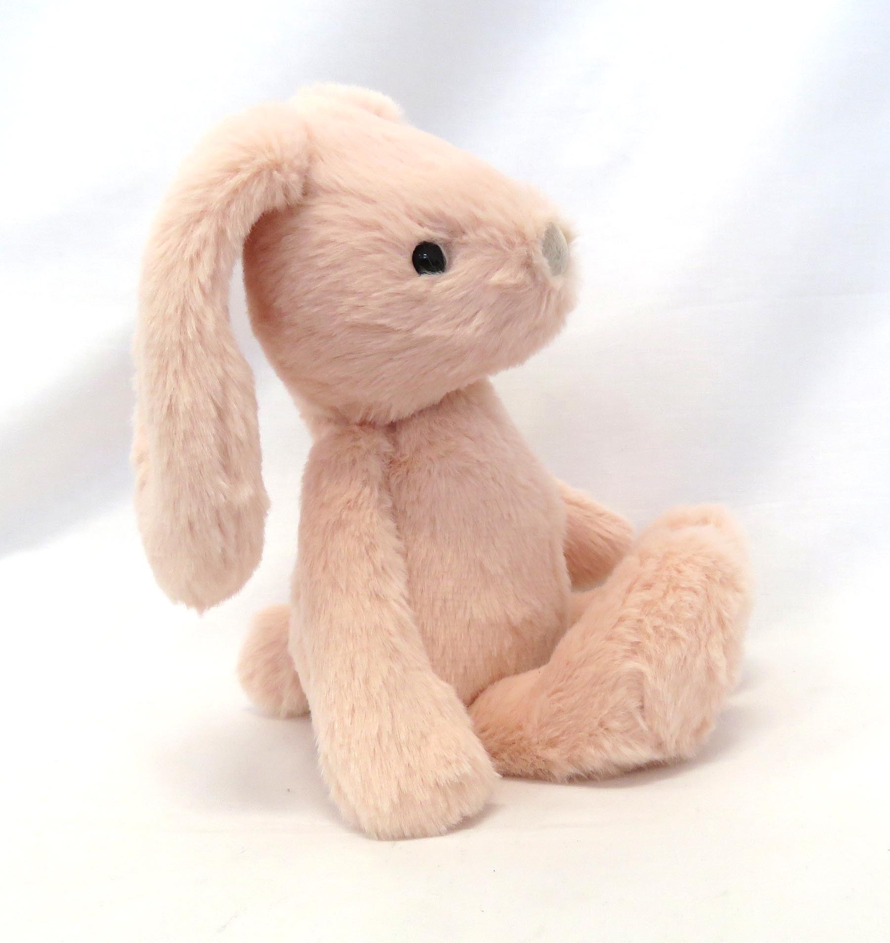 small peach pink bunny side view