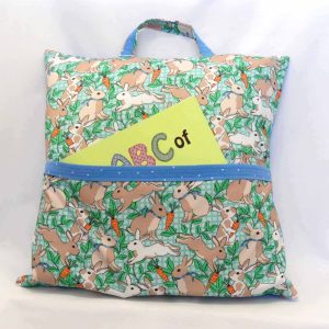 reading pillow - rabbits (blue) - front view with abc book