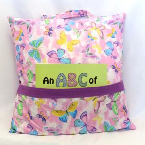 reading pillow - butterflies - front view with abc book