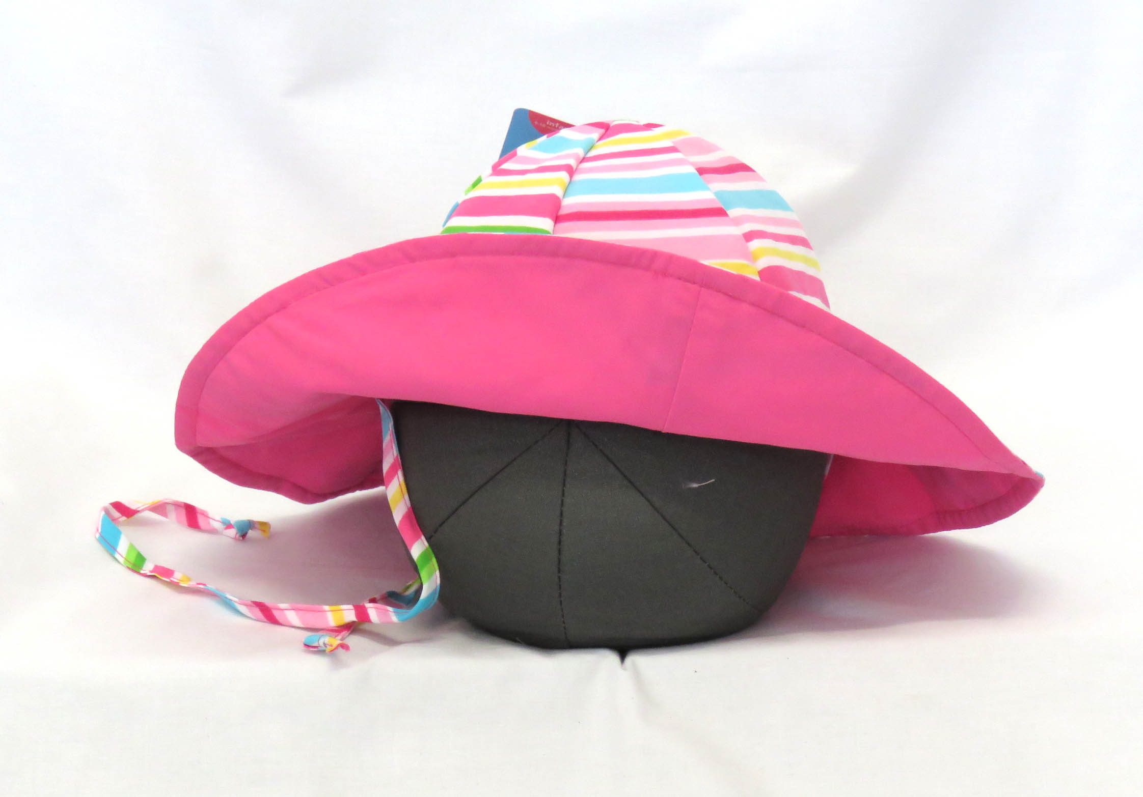 sunhat reversible coloured stripes and hot pink underneath front view