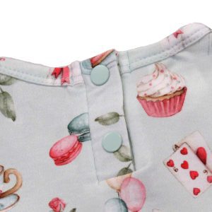 Snuggle Hunny pale green dress for toddlers - white rabbit design - close up of buttoned back