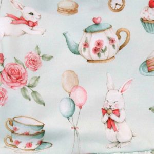Snuggle Hunny pale green dress for toddlers - white rabbit design - close up of rabbit design