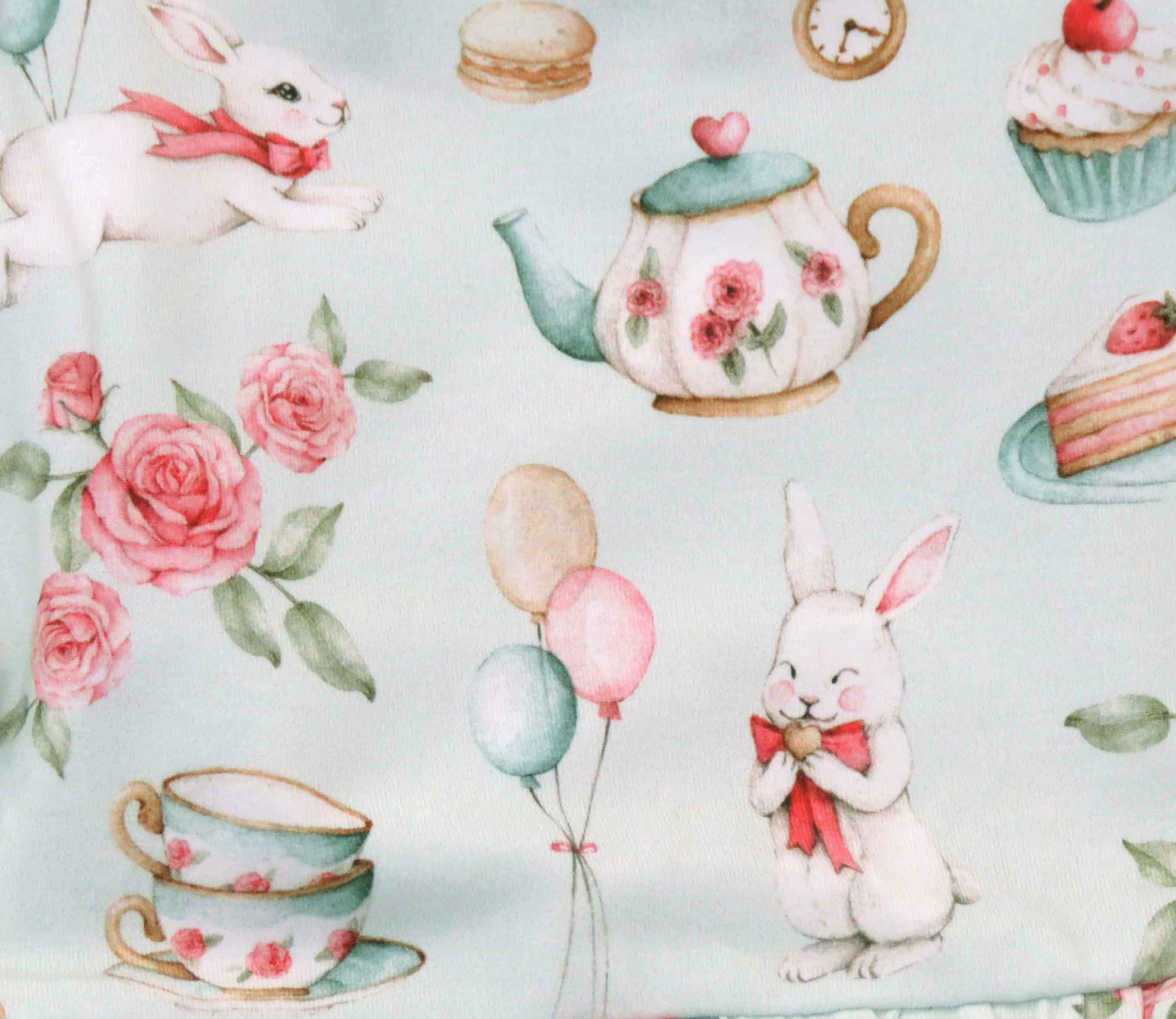 Snuggle Hunny pale green dress for toddlers - white rabbit design - close up of rabbit design